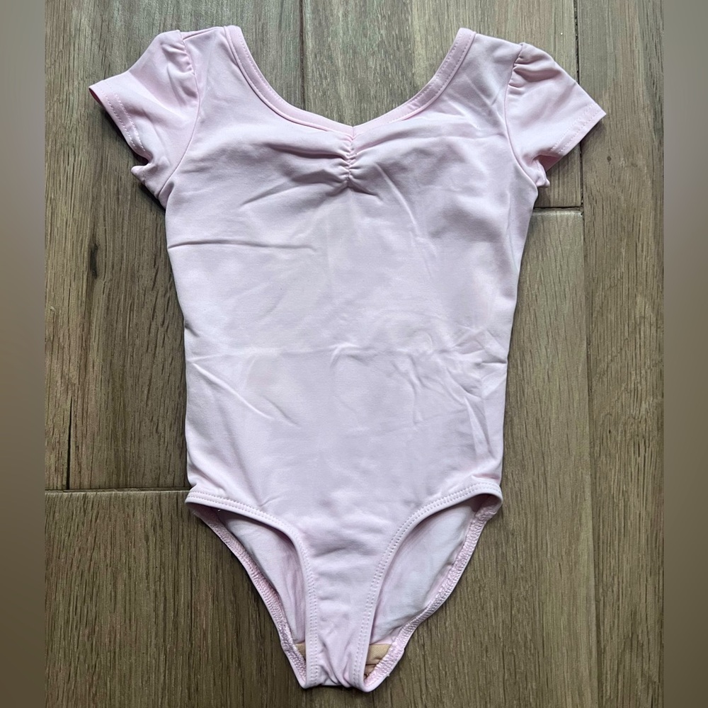 Pink Ballerina body suit.